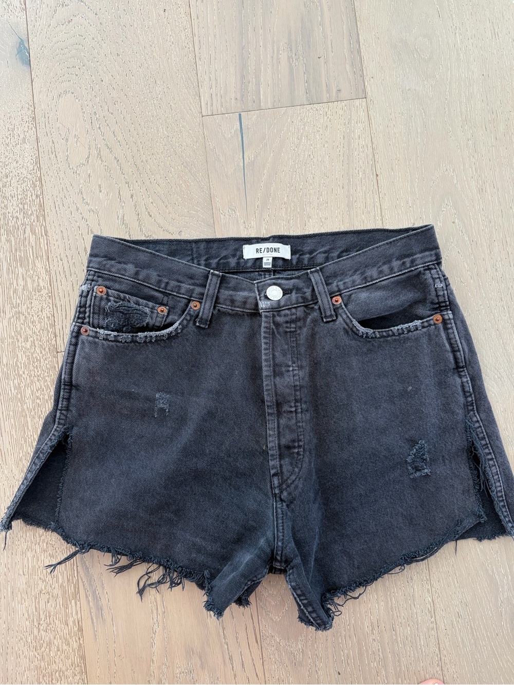Re/Done Washed Black High-Rise Distressed Side Slit Denim Shorts
